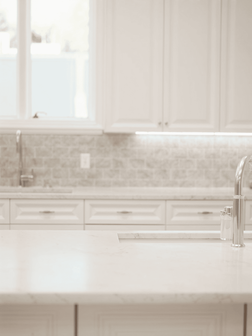 Refinished bright white kitchen cabinets and counters
